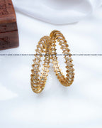 White oval stone spiral design AD stone gold bangles set of 2, RARUS Jewels