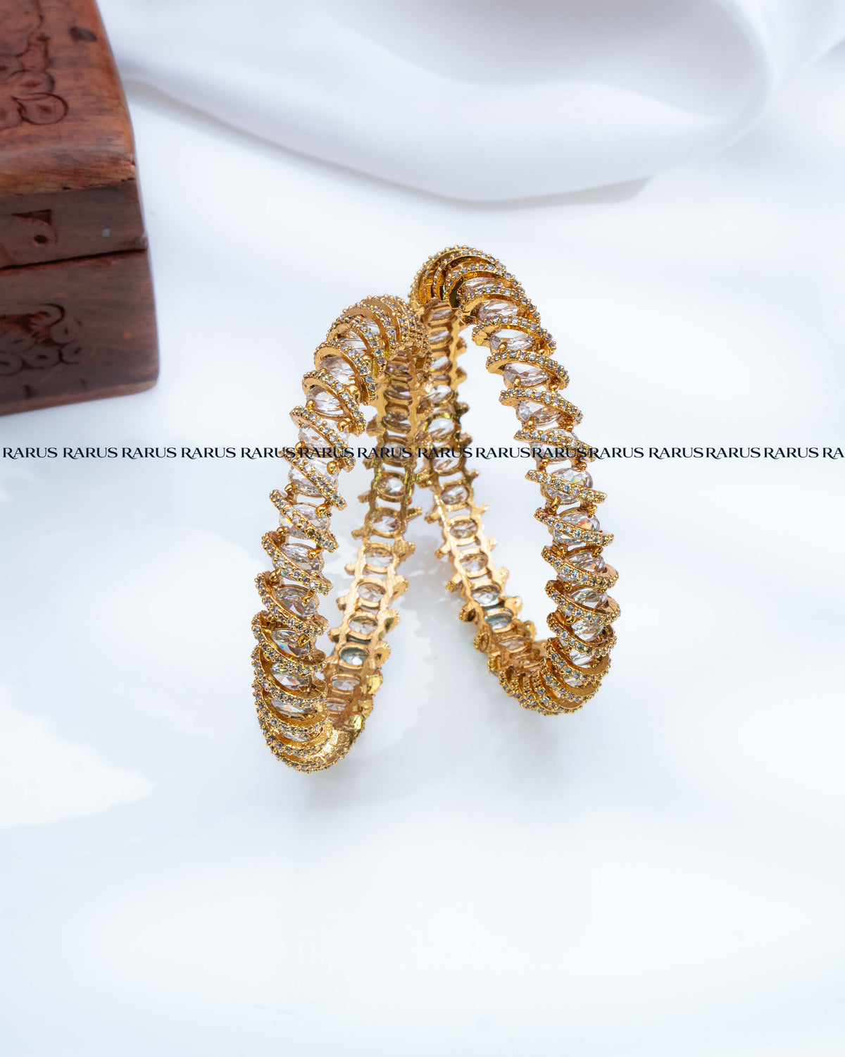 White oval stone spiral design AD stone gold bangles set of 2, RARUS Jewels