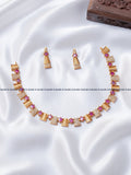 Ruby red leaf motif AD stone necklace set with gold leaf panels and matching earrings, RARUS Jewels