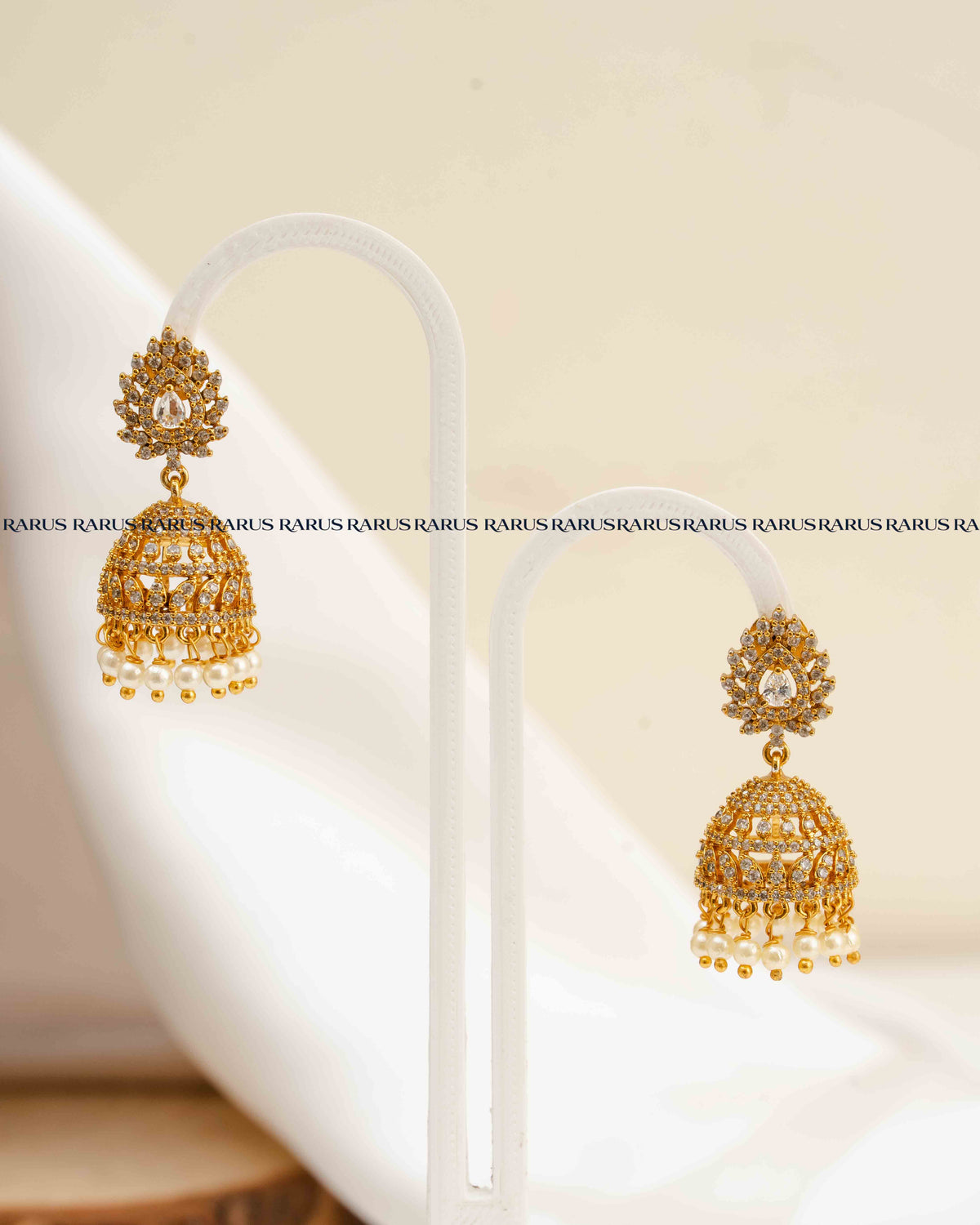 AD Stone Jhumka Earrings with Pearl Drops – White