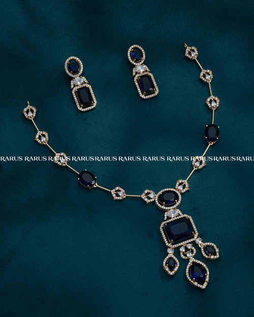 Premium chain pendant set with emerald-cut stone centerpiece & matching earrings. 6 colors available. Everyday glam, imitation jewellery price.