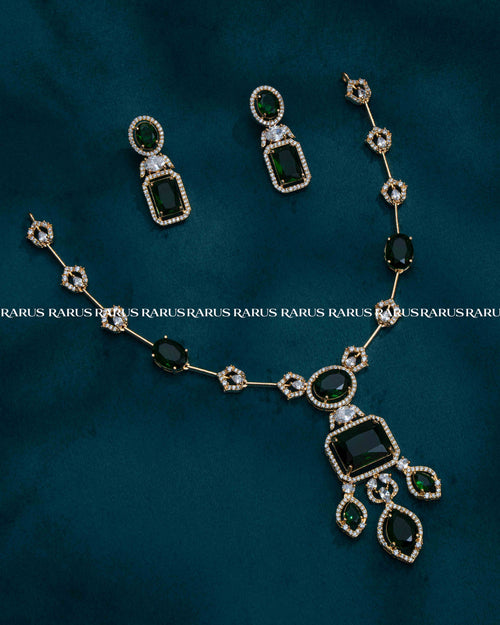 Premium chain pendant set with emerald-cut stone centerpiece & matching earrings. 6 colors available. Everyday glam, imitation jewellery price.